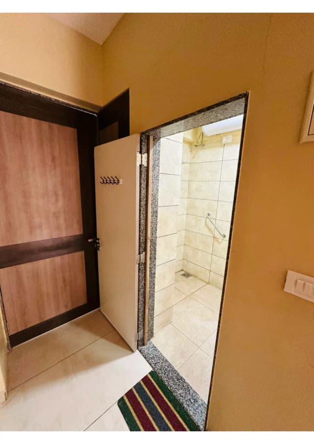 Twin sharing rooms with modified spacious toilet with grab bars, reachable cupboard and drawers, wide doors.