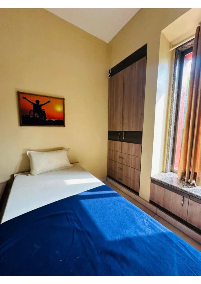 Twin sharing rooms with modified spacious toilet with grab bars, reachable cupboard and drawers, wide doors.